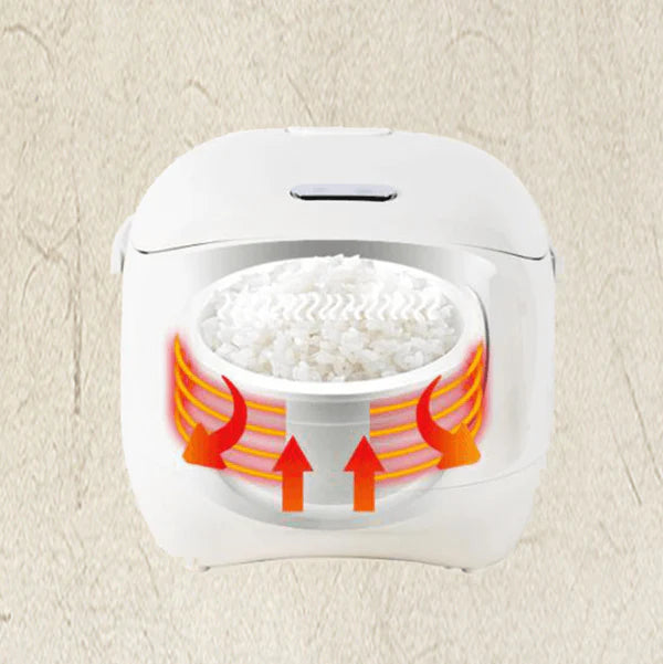 White rice cooker with rice inside on a beige background