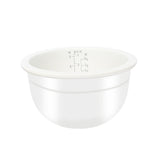 White measuring bowl with volume markings on a white background
